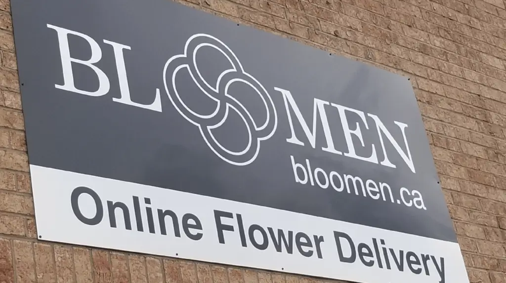 Bloomen's sign on a brick wall: Bloomen, bloomen.ca, Online Flower Delivery
