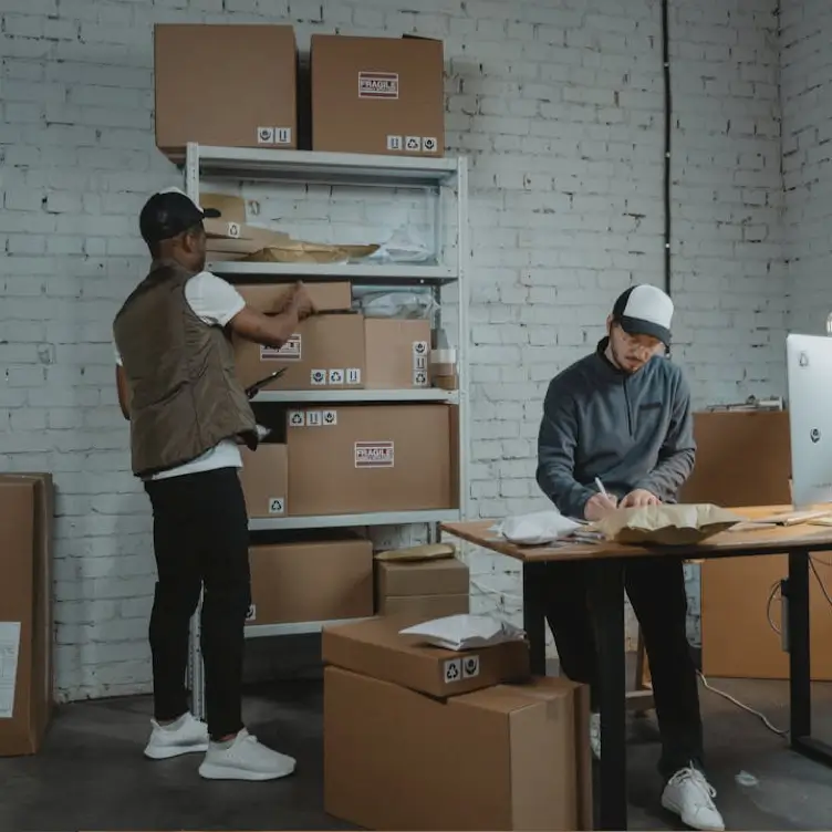 A team packing orders by hand